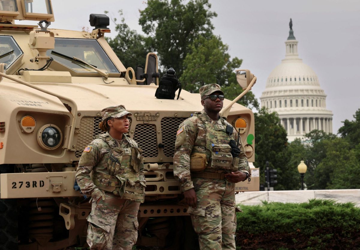 With the dome of the U.S. Capitol in the background, members of the DC National Guard keep watch outside Union Station after U.S. President Donald Trump deployed the National Guard and ordered an increased federal law enforcement presence to assist in crime prevention, in Washington, D.C., August 19, 2025. REUTERS/Kevin Lamarque