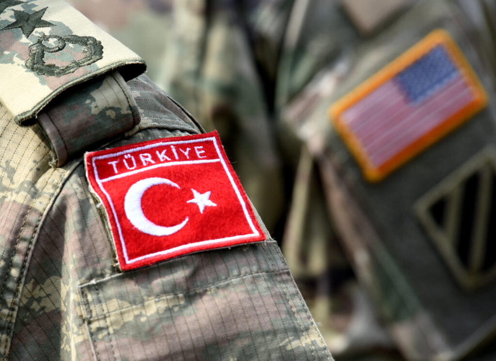 Turkish flag and US flag on army uniform. Turkish and US troops